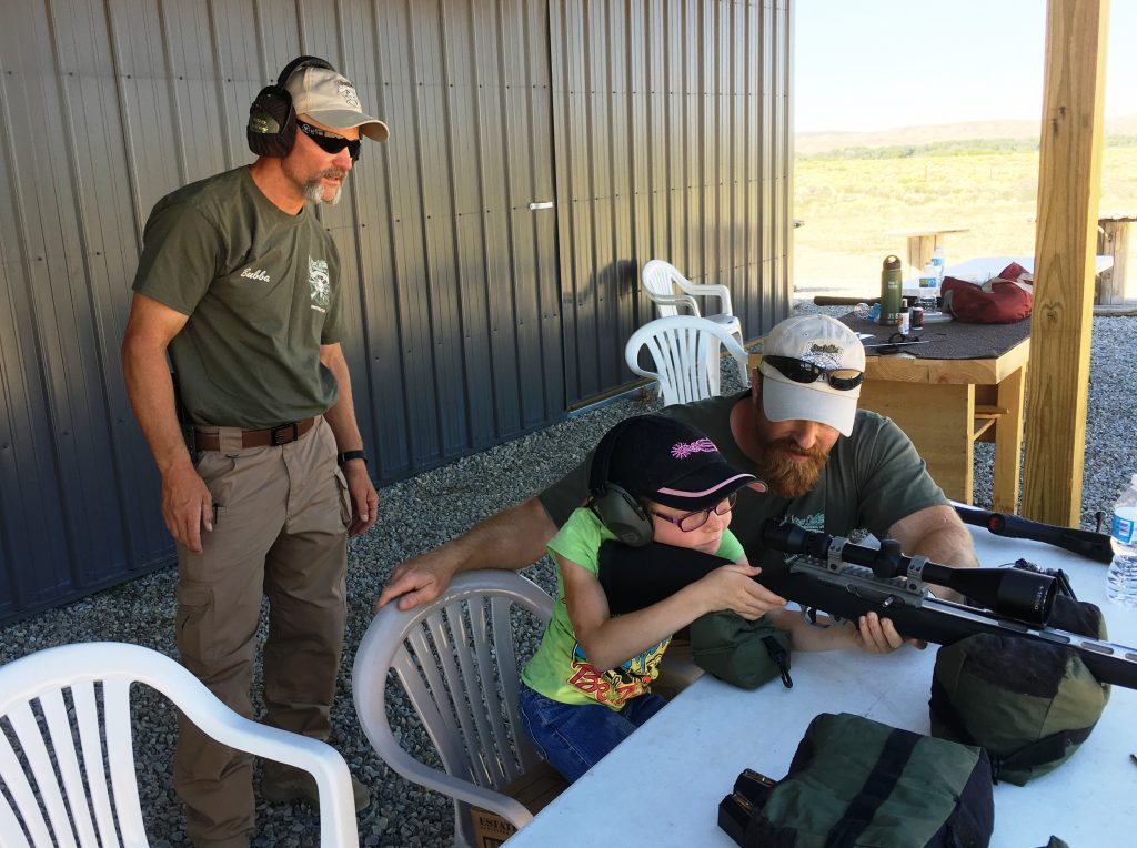 Our youth classes are always a hands on, one-on-one experience. While Tom works with this young shooter, Bubba calls out hits.